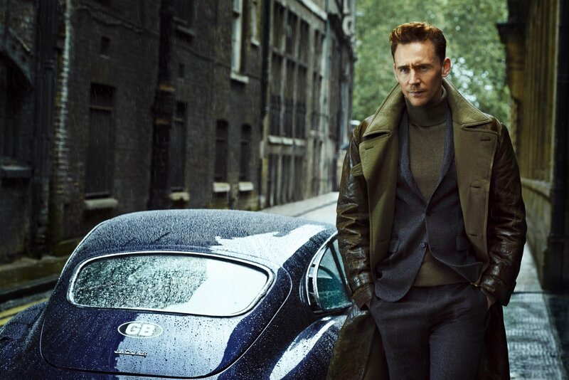 man in trench coat on rainy street