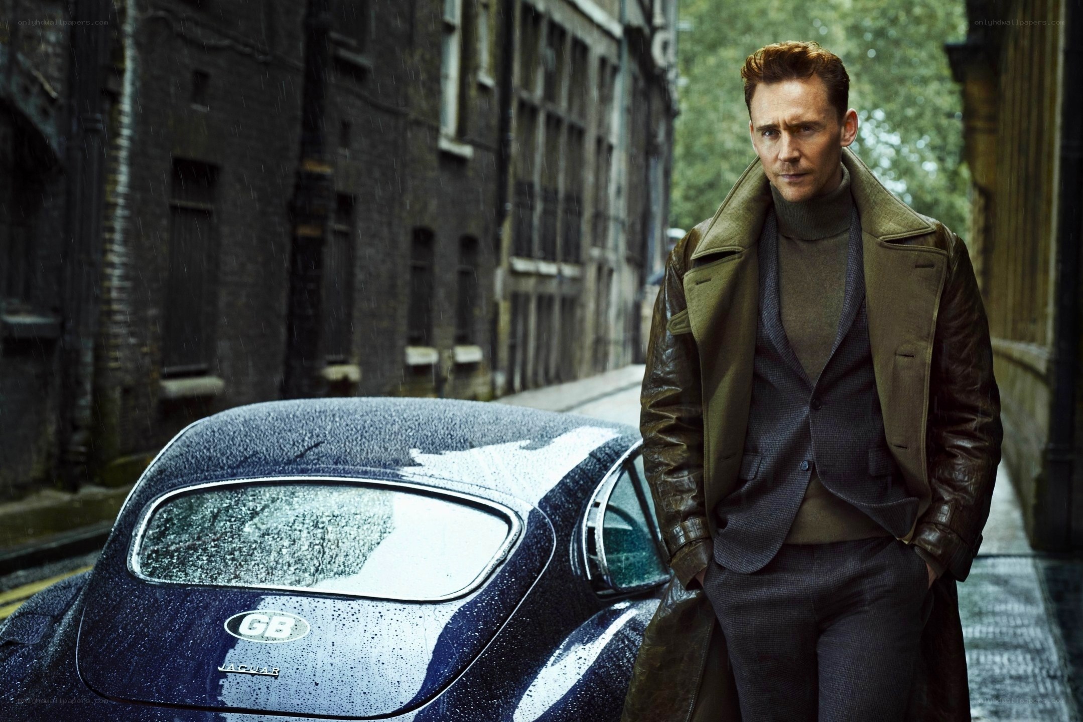 man in trench coat on rainy street