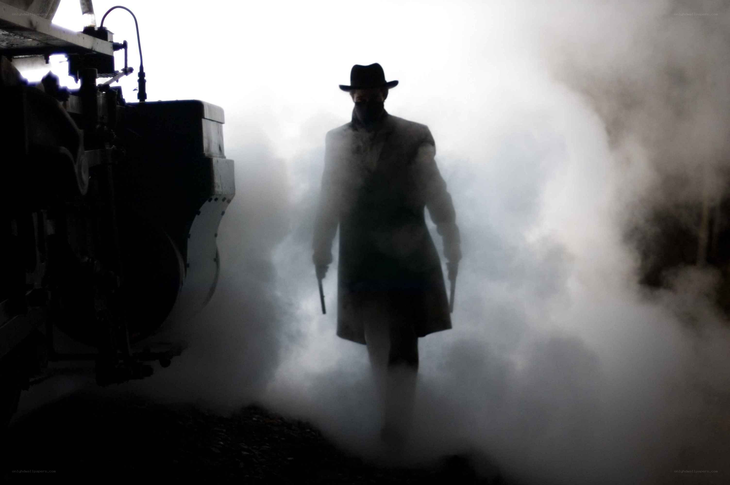 man in trench coat with guns
