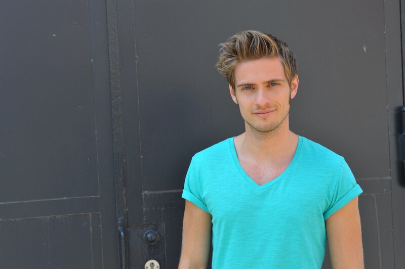 man in turquoise t-shirt