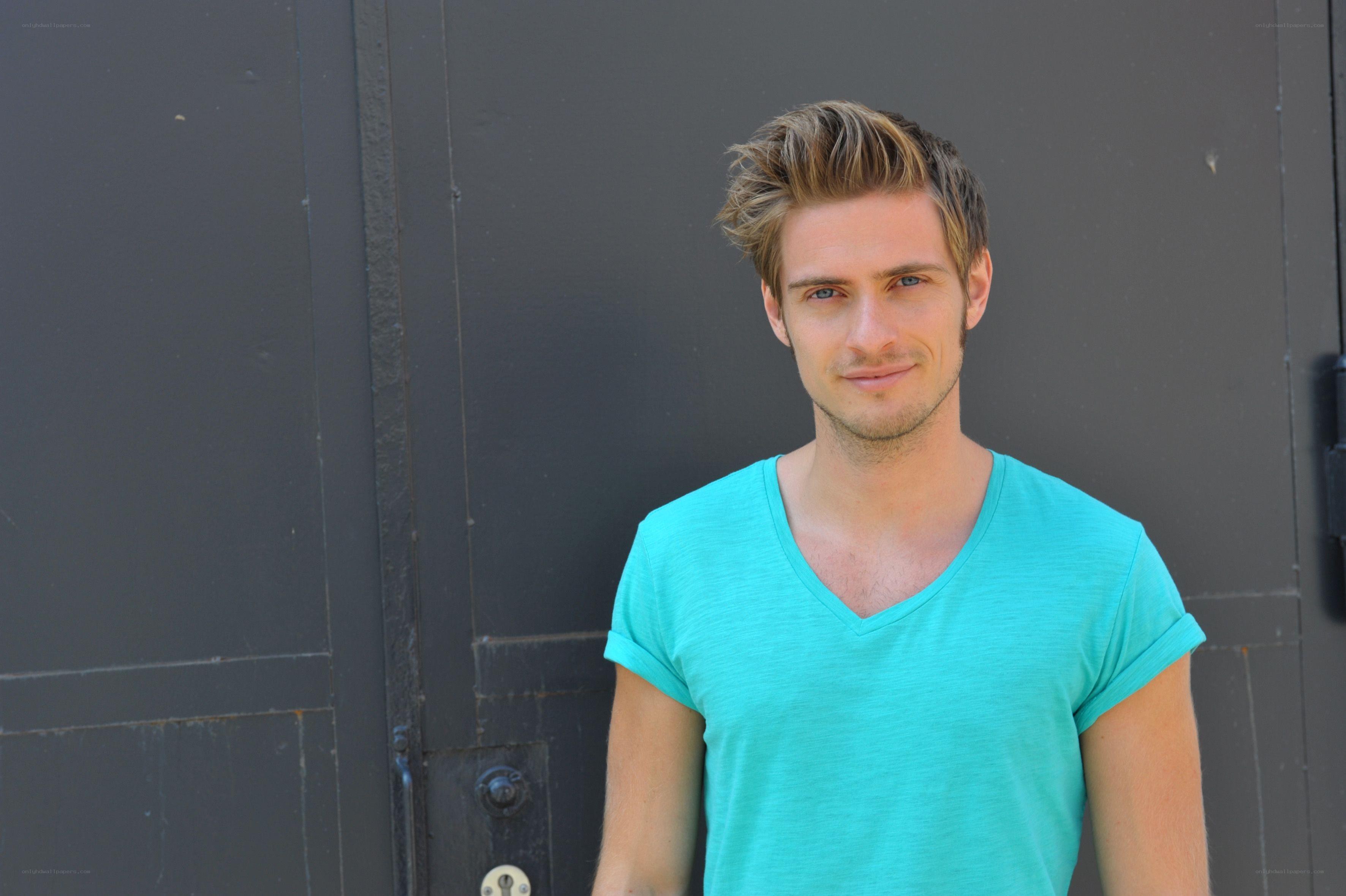 man in turquoise t-shirt