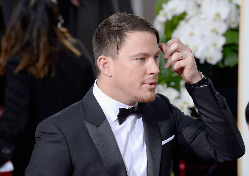 man in tuxedo adjusting hair