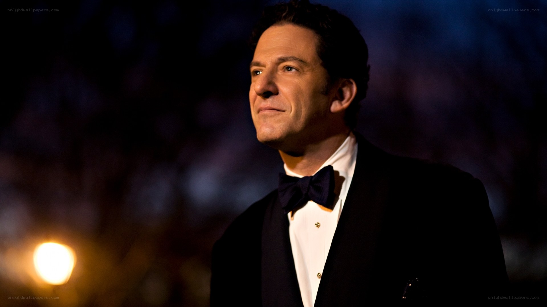 man in tuxedo at night