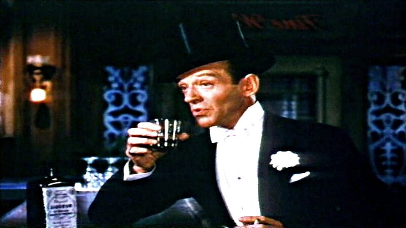 Man in Tuxedo Holding Glass