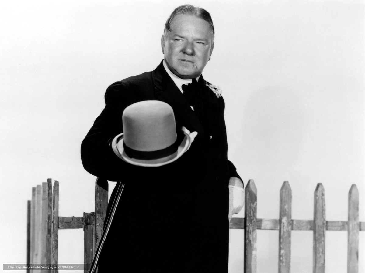 Man in Tuxedo Holding Hat