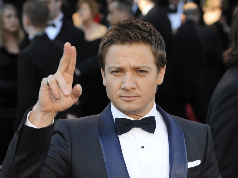 Man in Tuxedo Making Hand Gesture