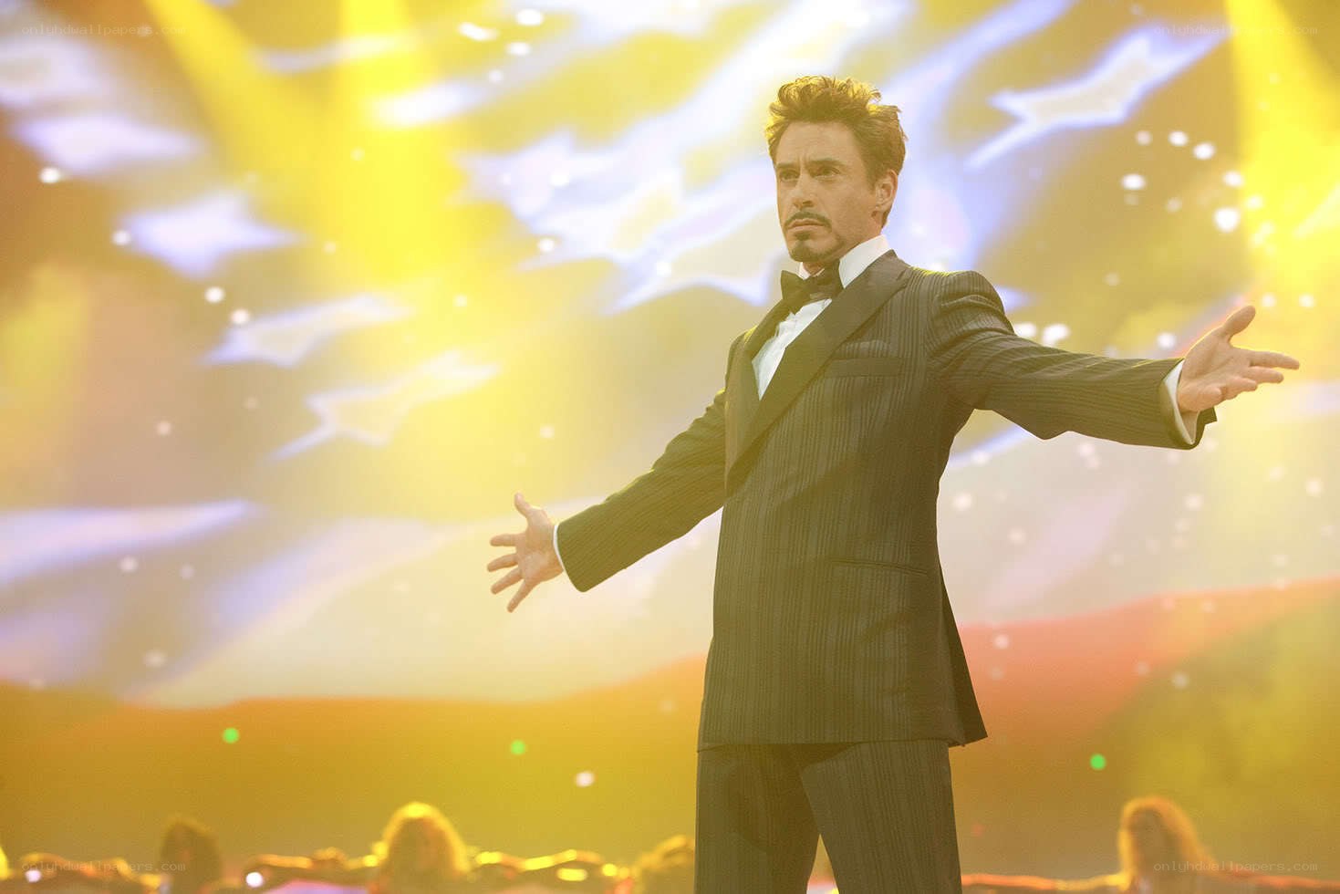 Man in tuxedo on stage
