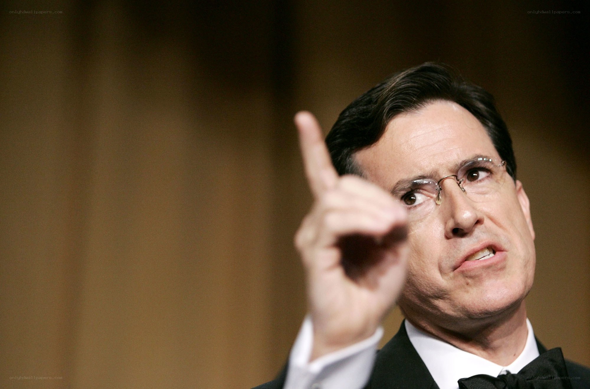 man in tuxedo pointing finger