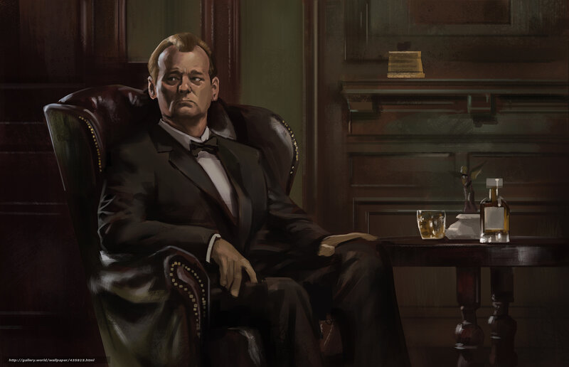 man in tuxedo sitting in chair