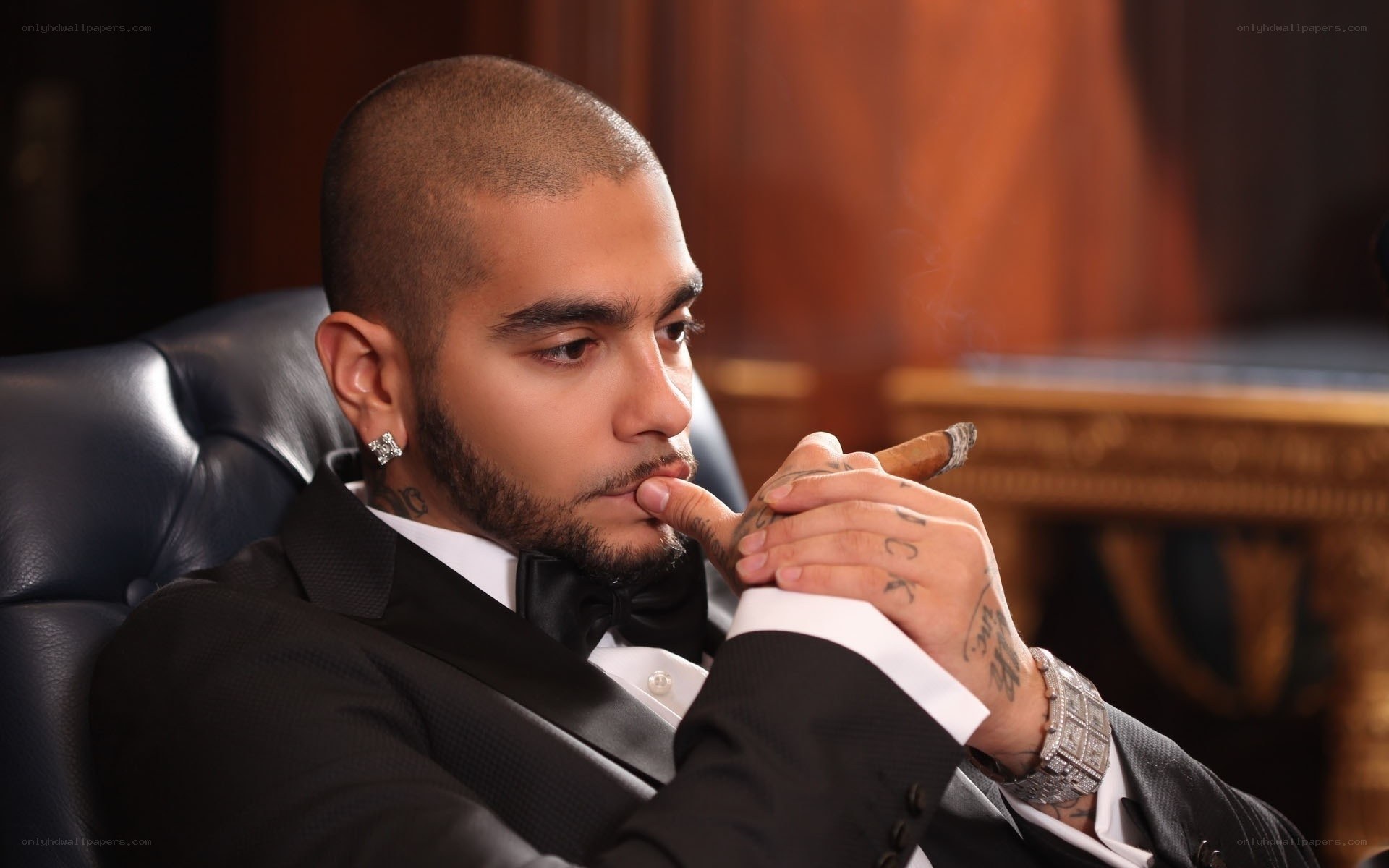 man in tuxedo smoking cigar