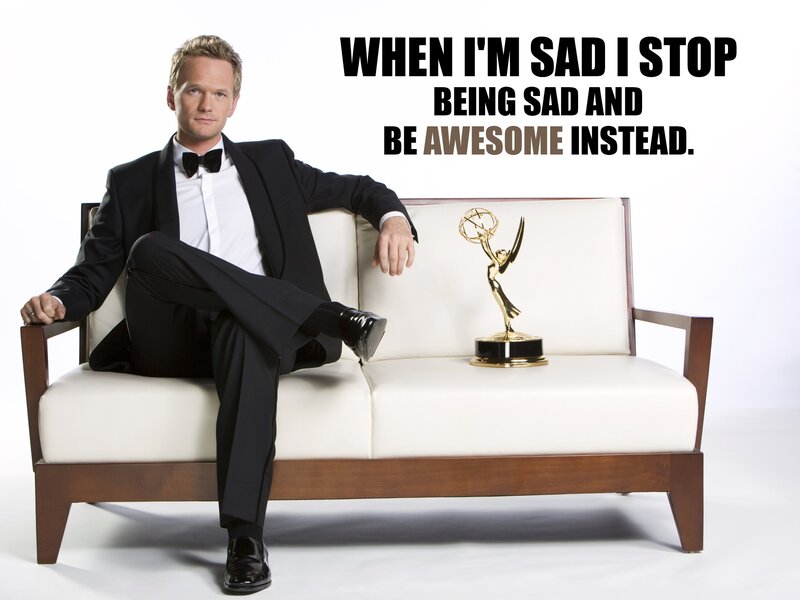 Man in tuxedo with Emmy award