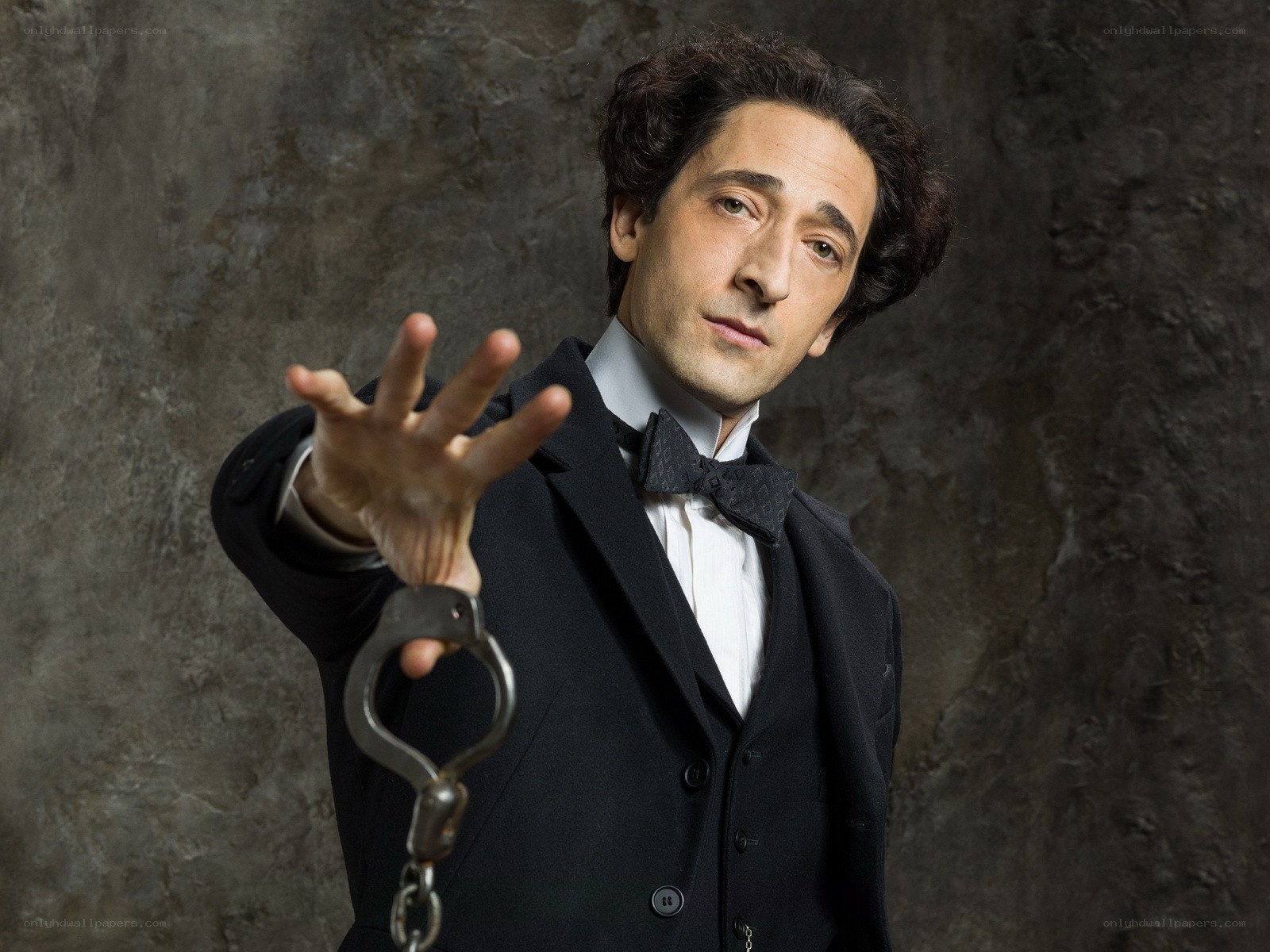 man in tuxedo with handcuffs