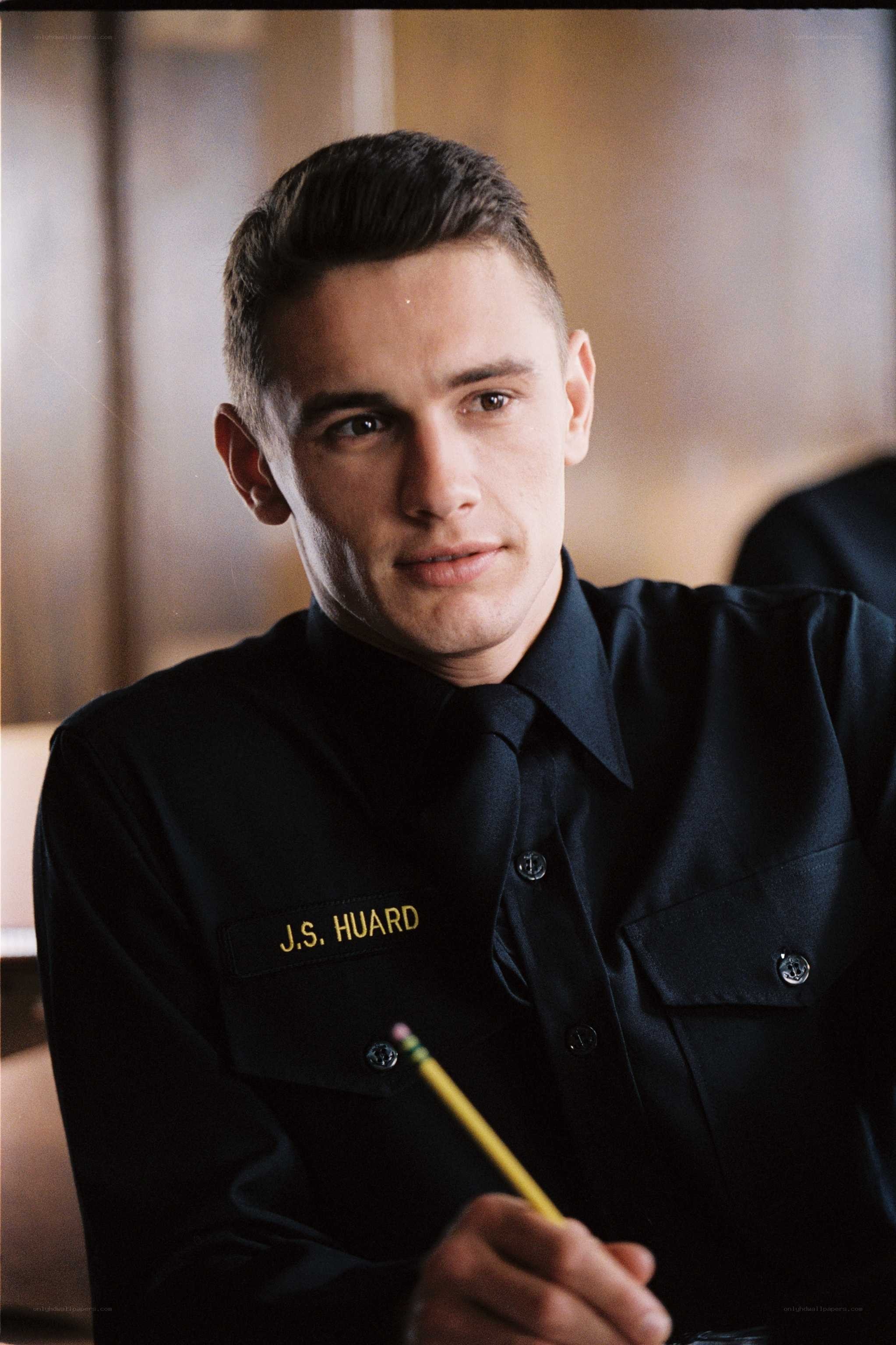 Man in uniform holding pencil
