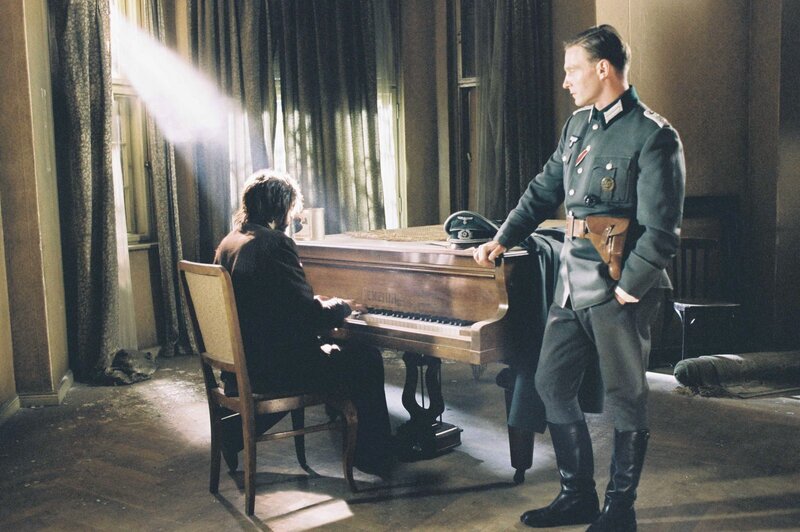 Man in uniform watches pianist