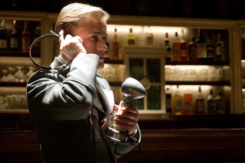 Man in uniform with vintage phone