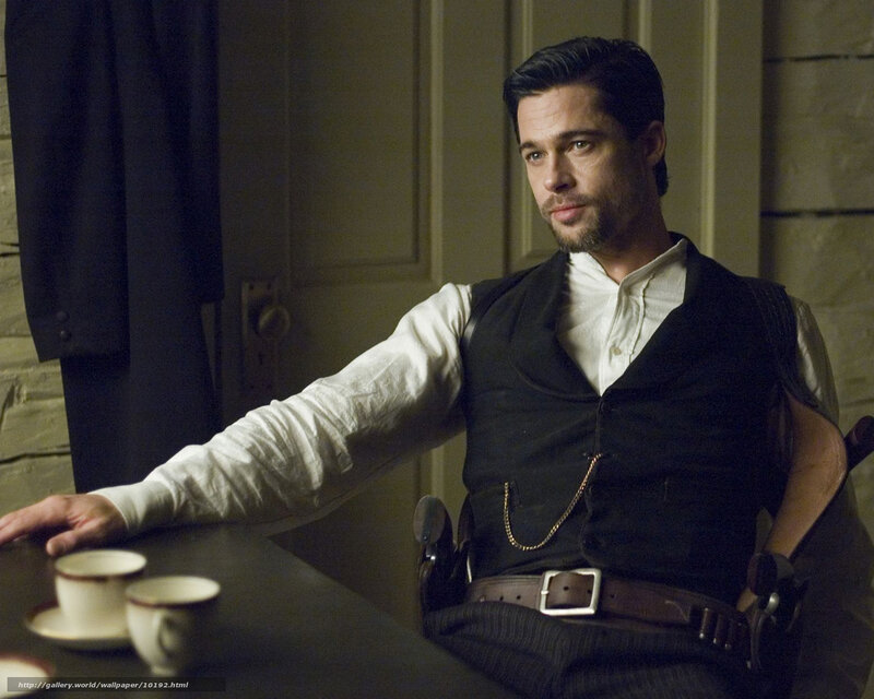 man in vest at table