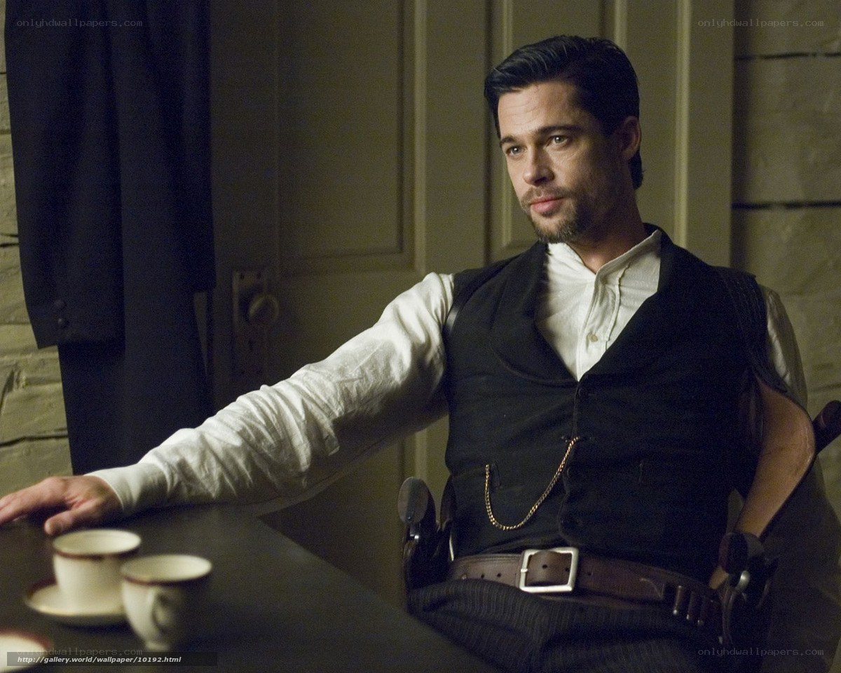 man in vest at table
