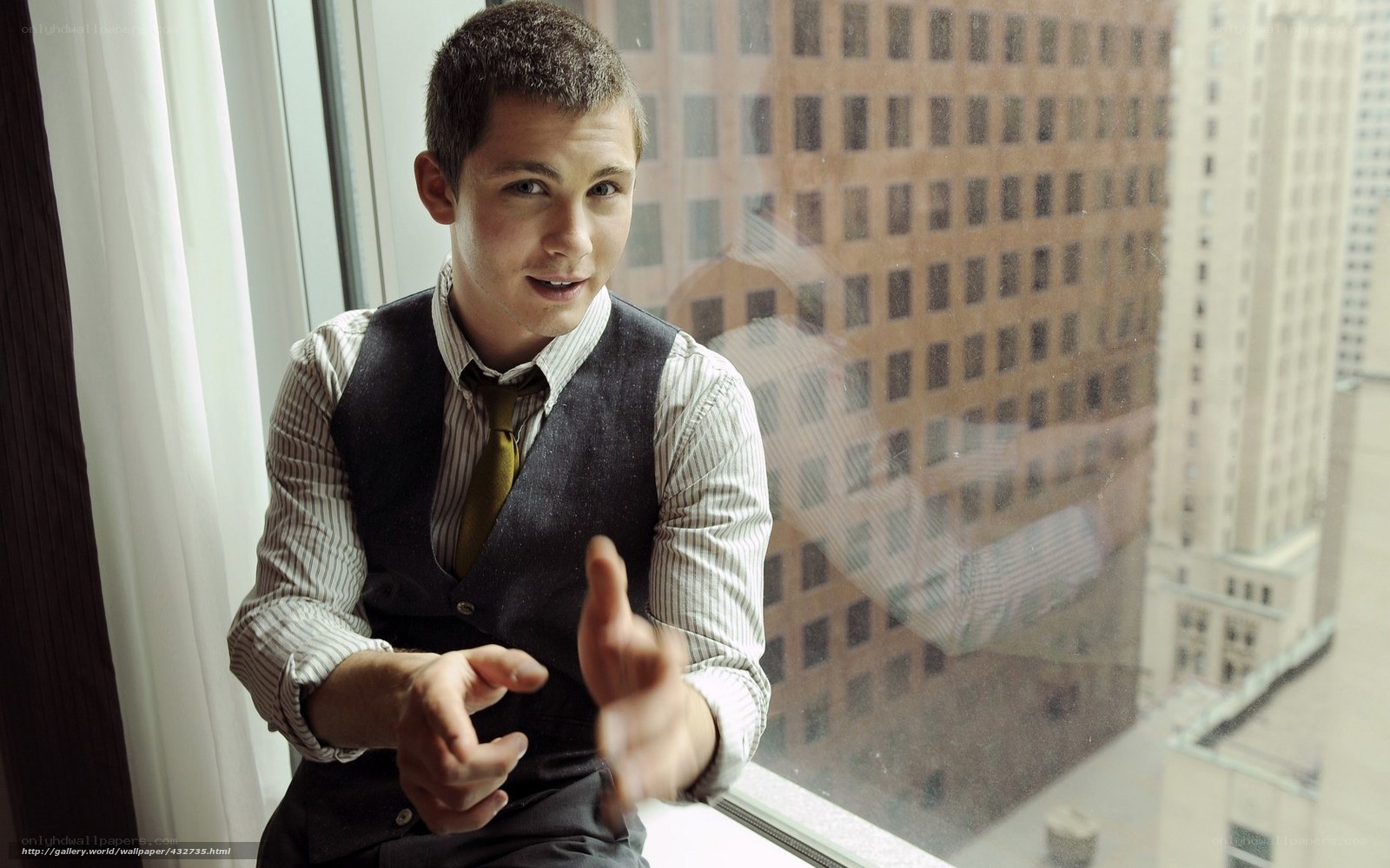 man in vest by window