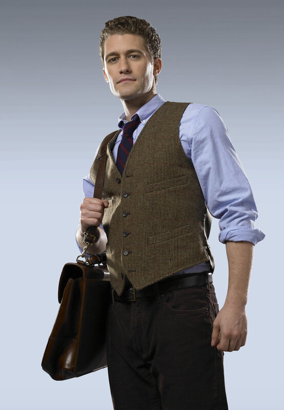 man in vest holding briefcase