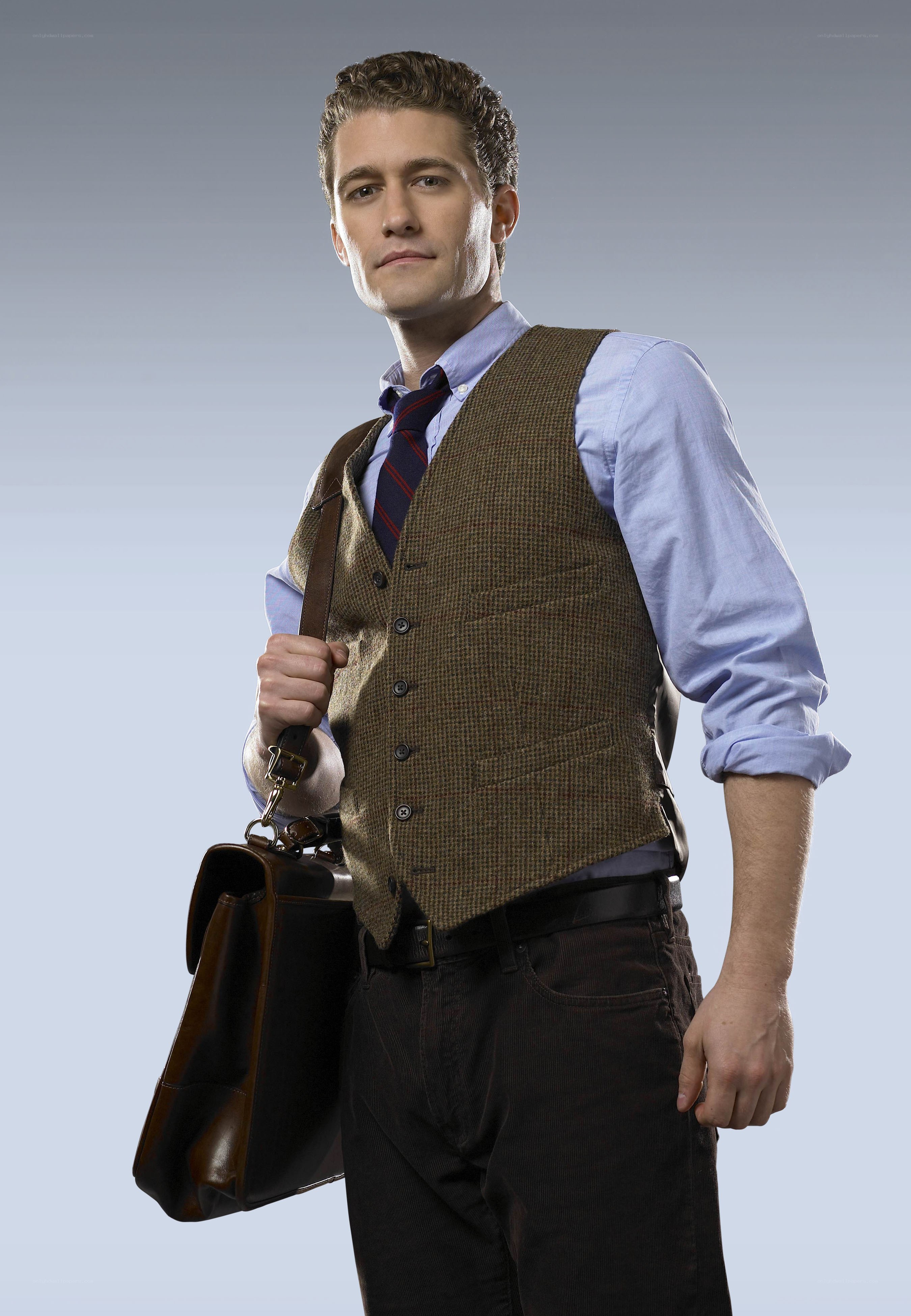 man in vest holding briefcase