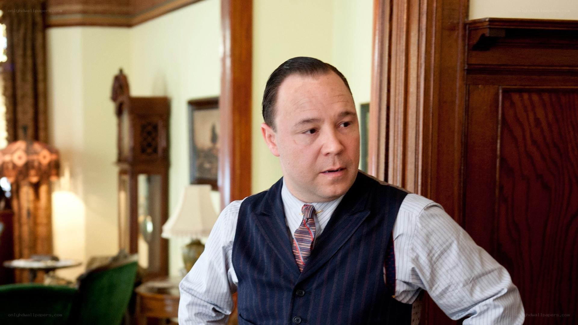 man in vest looking concerned