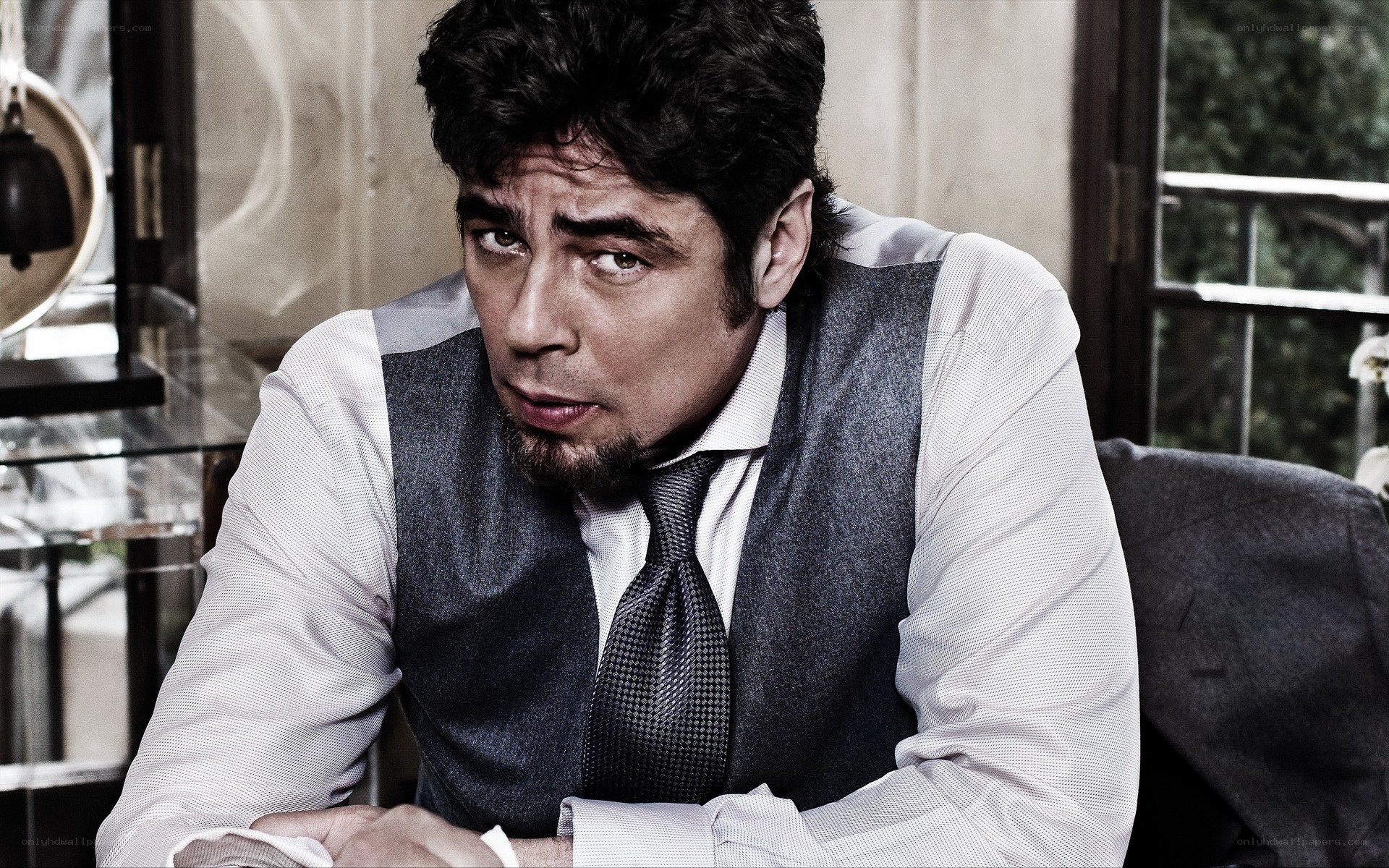 man in vest looking serious