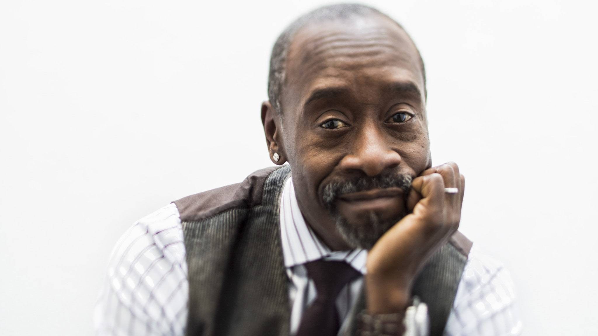man in vest smiling