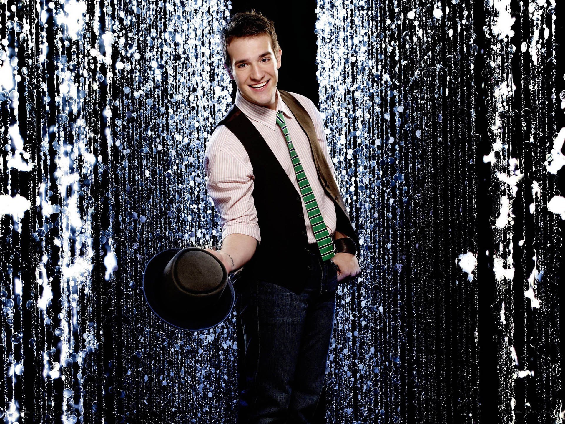 man in vest with hat