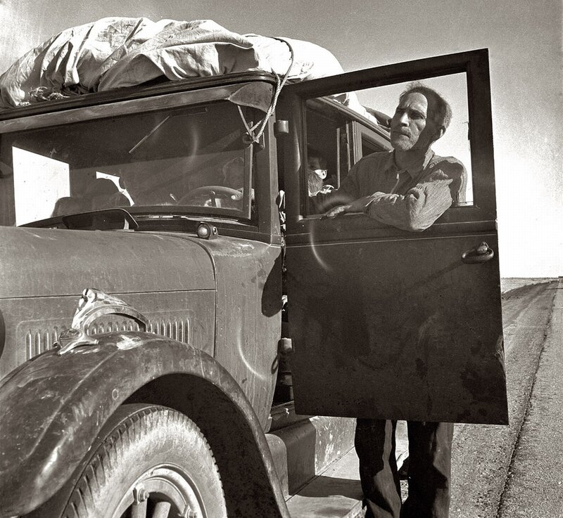 Man in vintage car on road