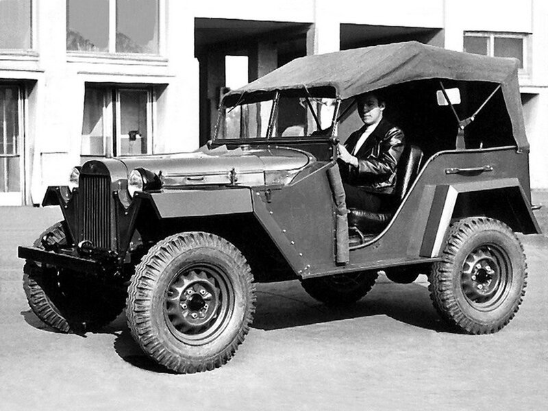 Man in vintage military jeep