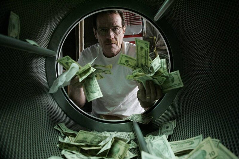 man in washing machine with money
