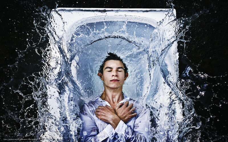 man in water splashing