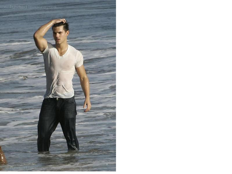 man in wet clothes at beach