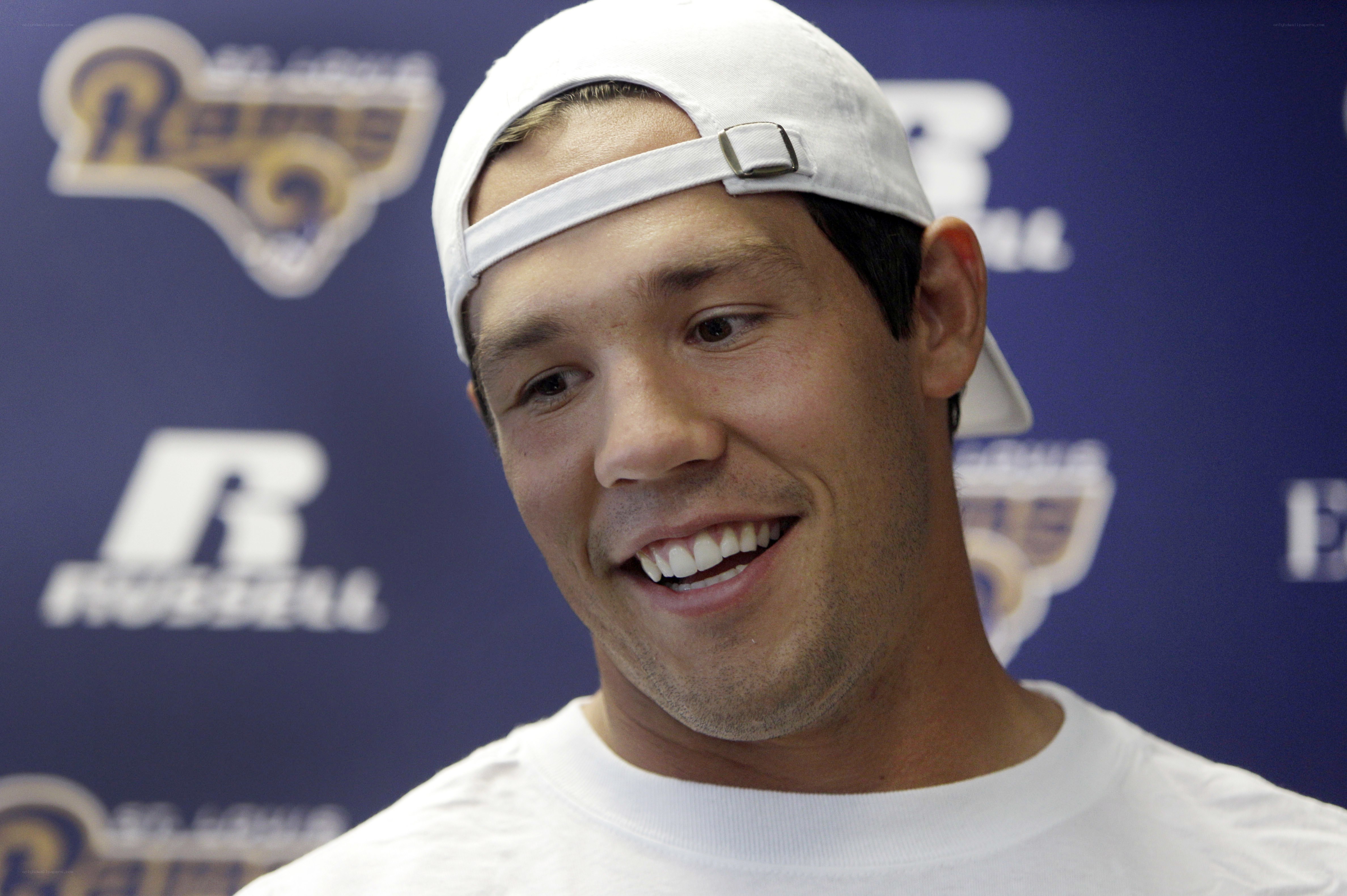 man in white cap smiling