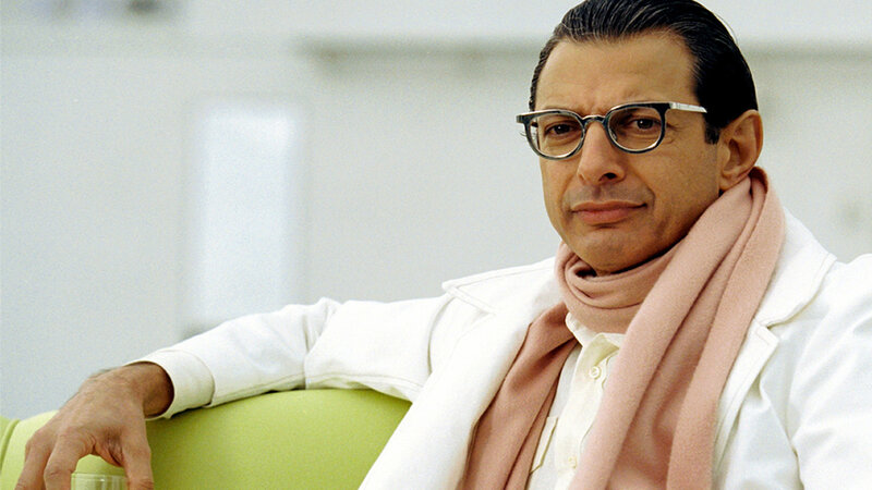 man in white coat and glasses