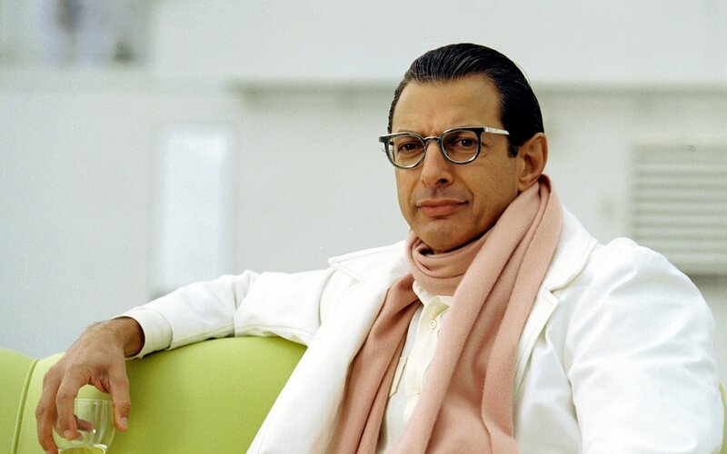 Man in white coat and glasses