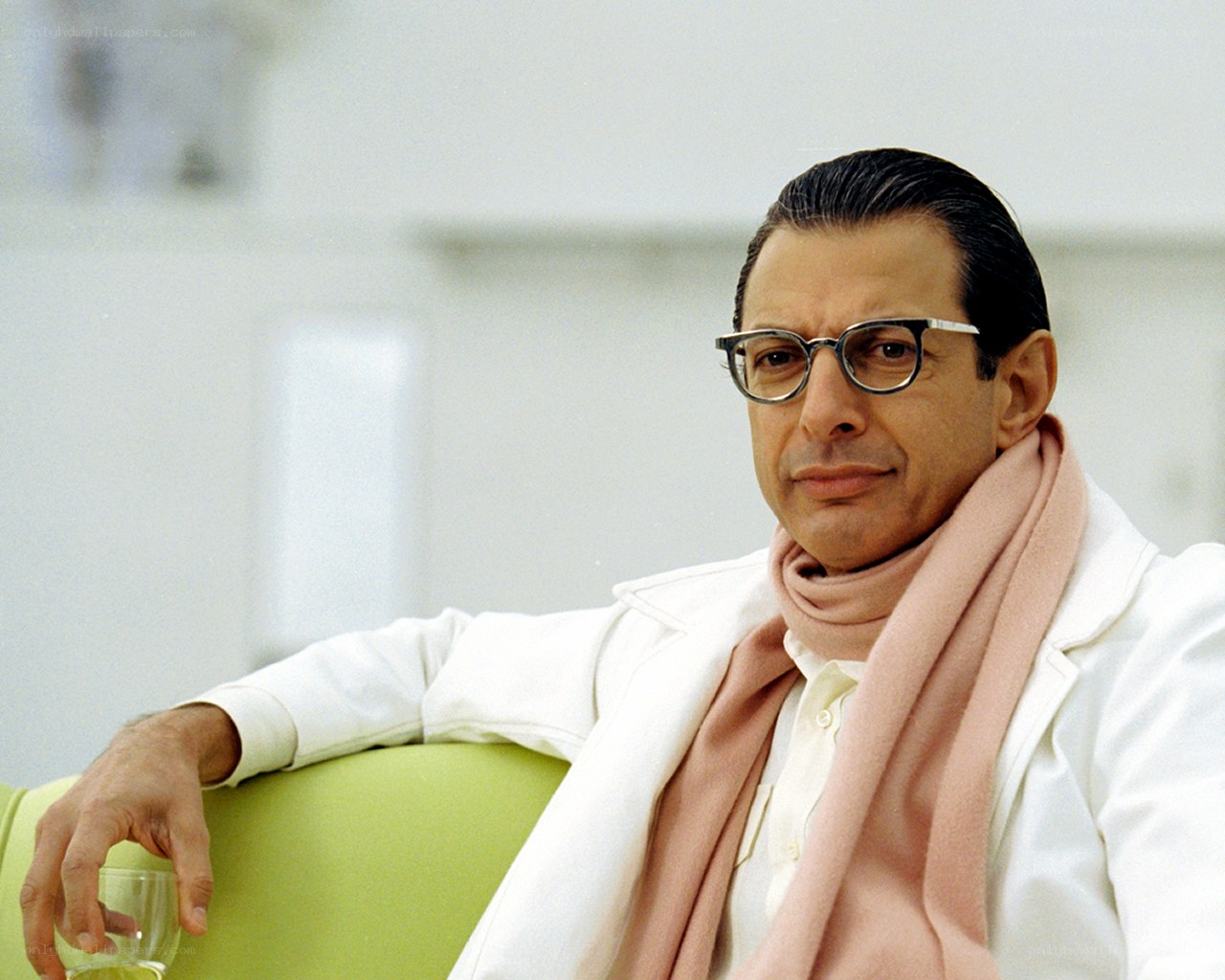 man in white coat and glasses