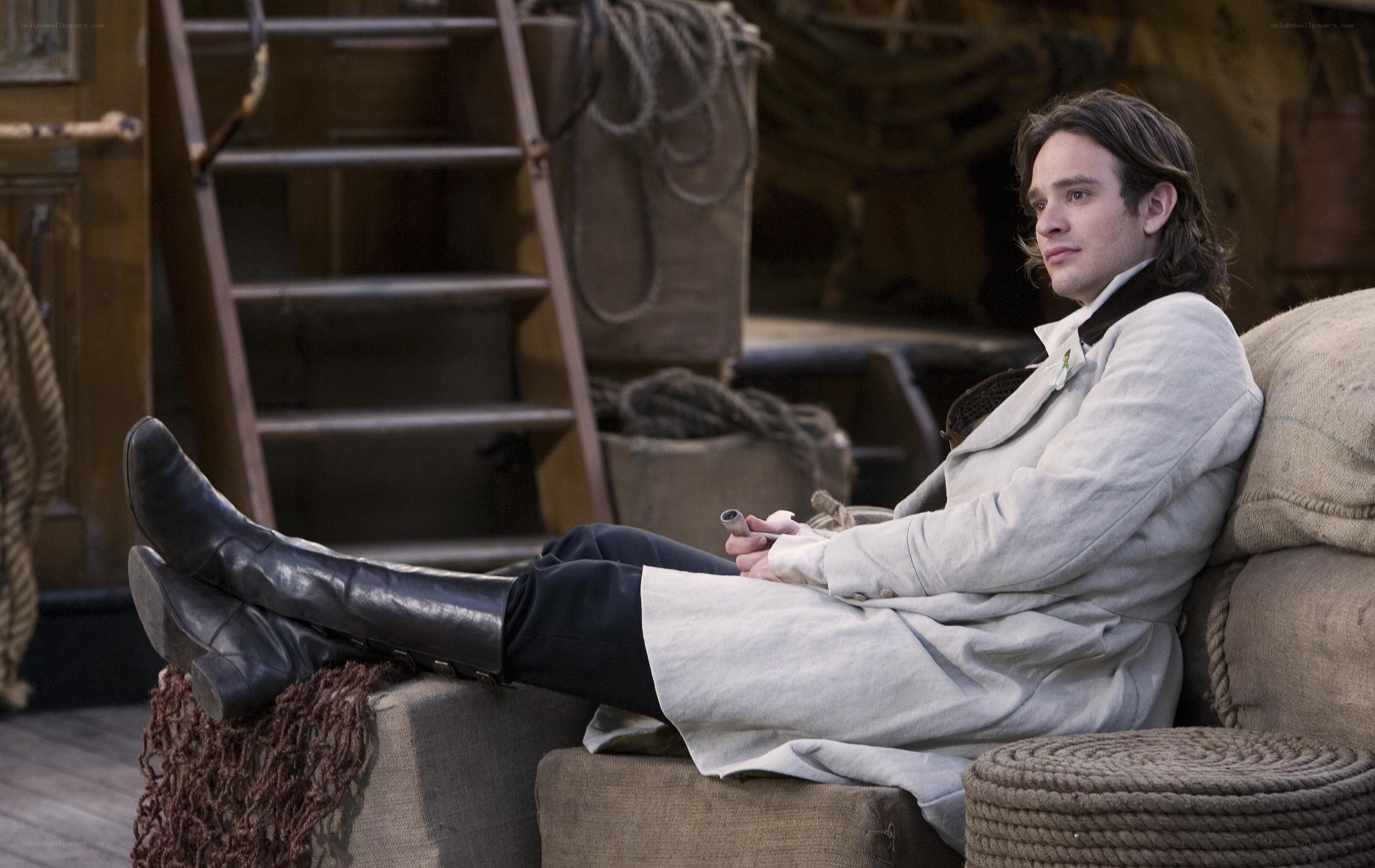 man in white coat on ship