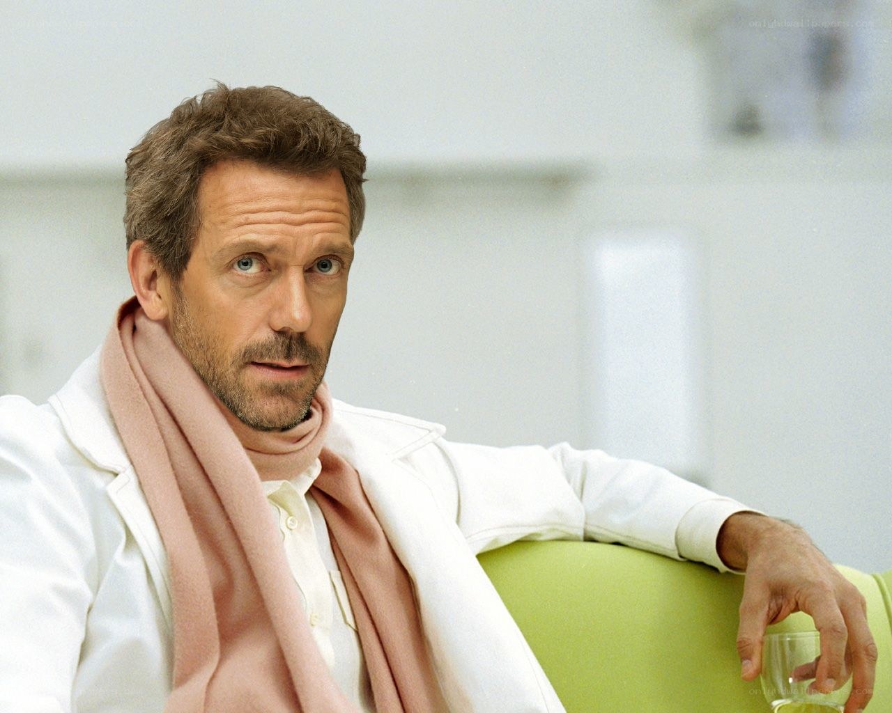 man in white coat sitting