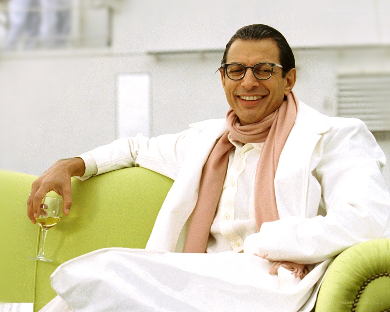 Man in white coat smiling