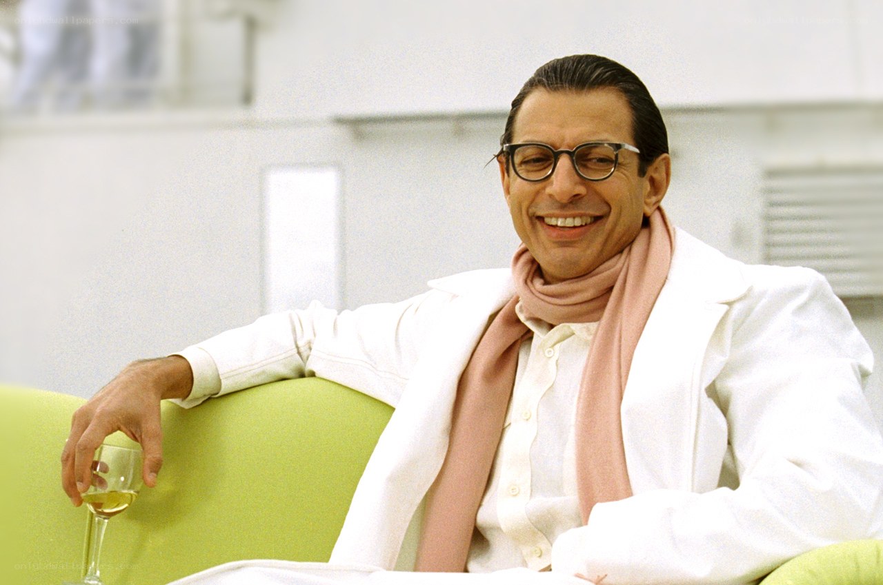 Man in white coat smiling