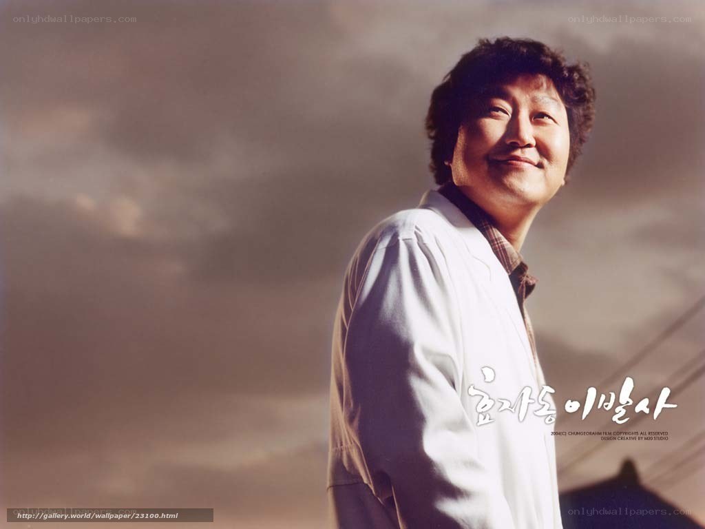 man in white coat smiling