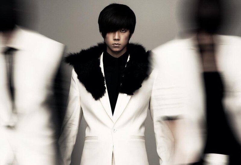 man in white coat with fur collar