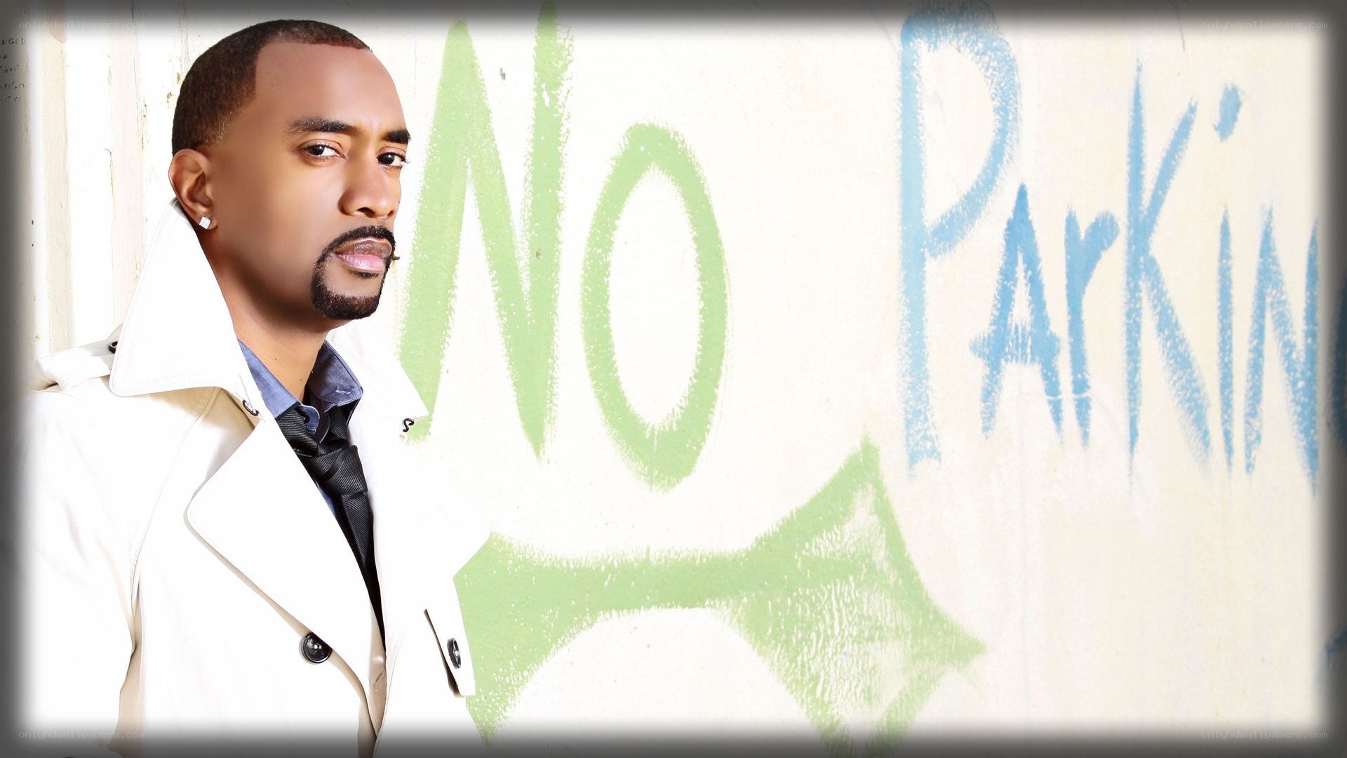 man in white coat with graffiti