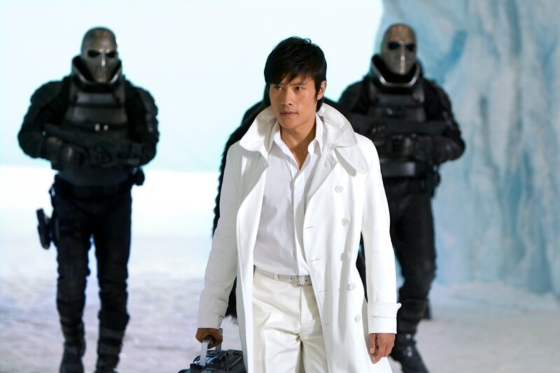 Man in white coat with soldiers