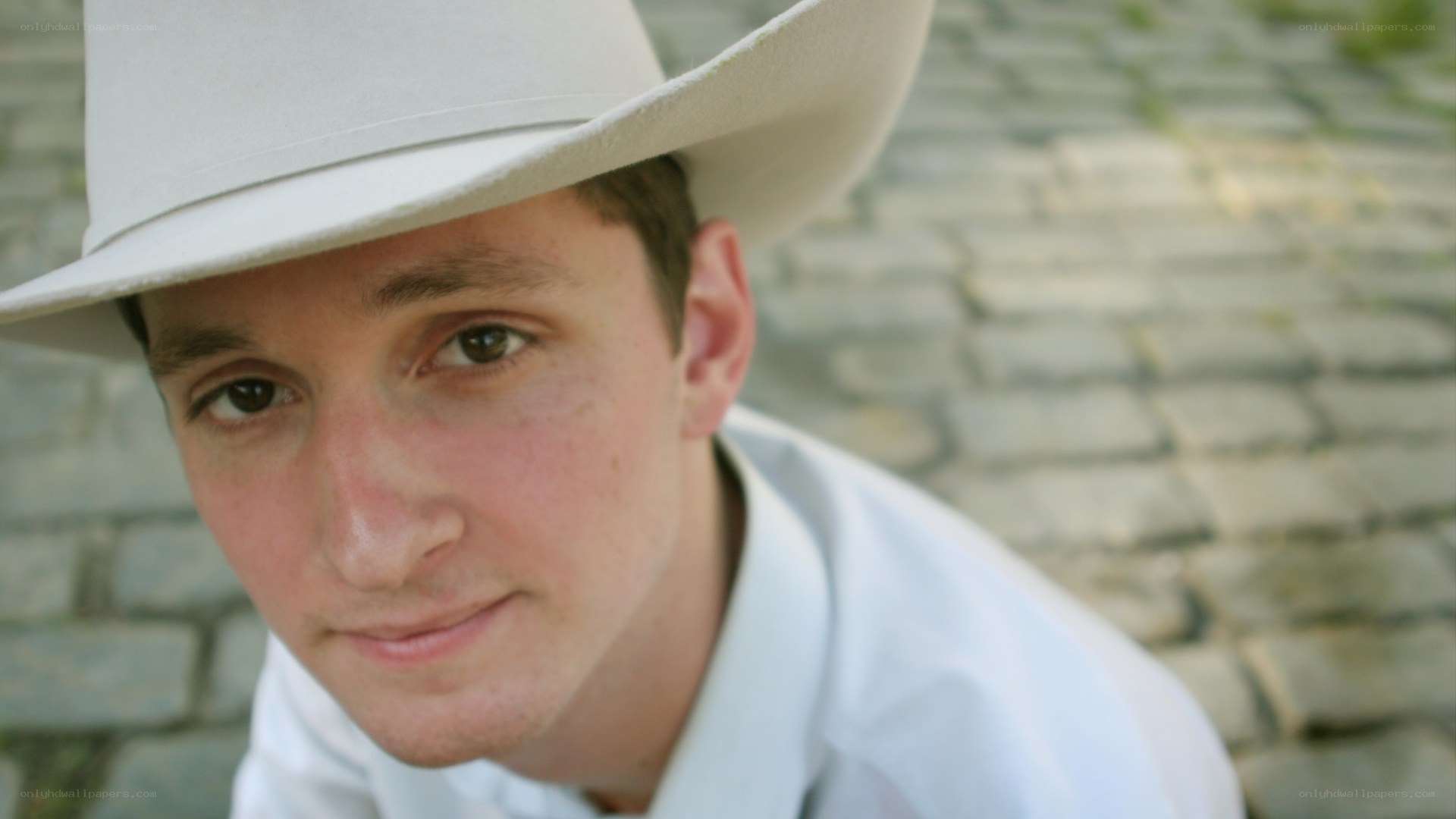 man in white cowboy hat