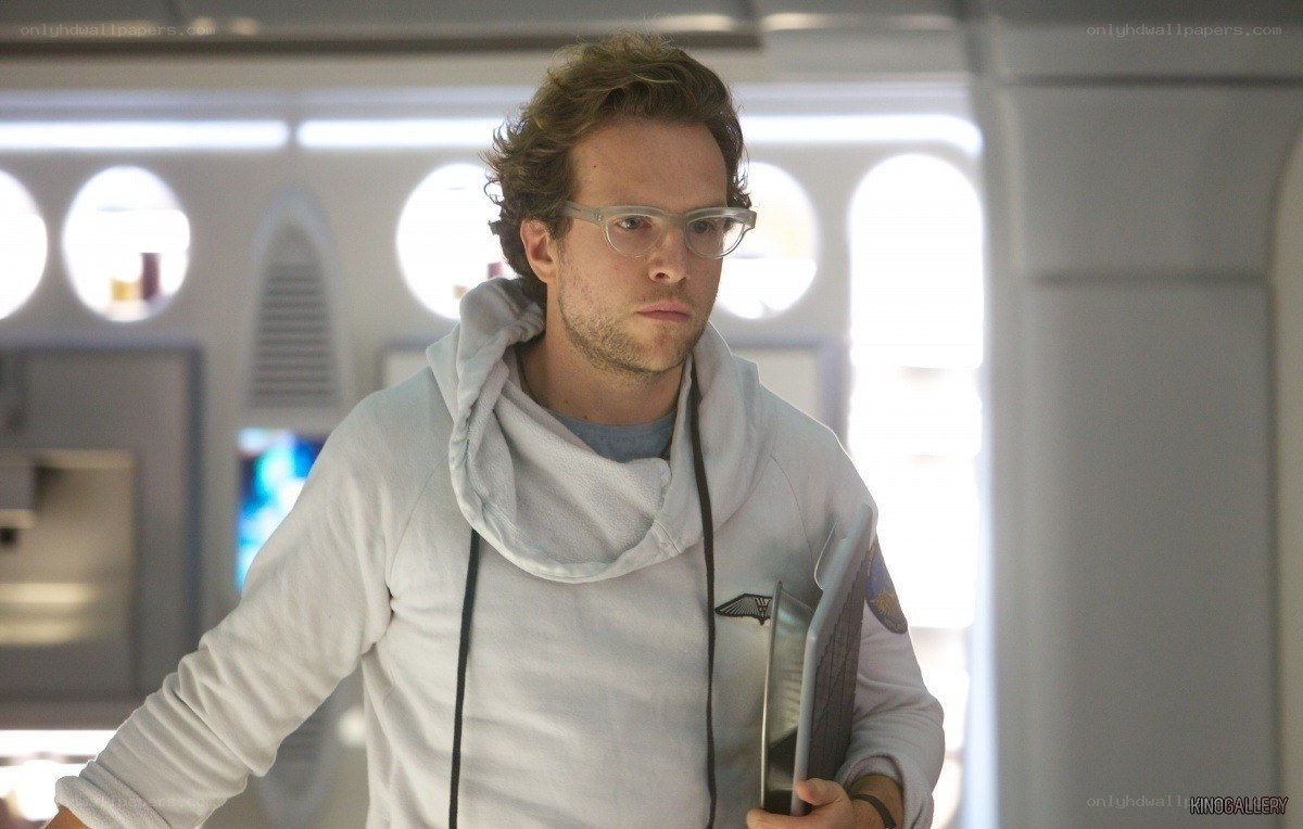 man in white hoodie holding tablet
