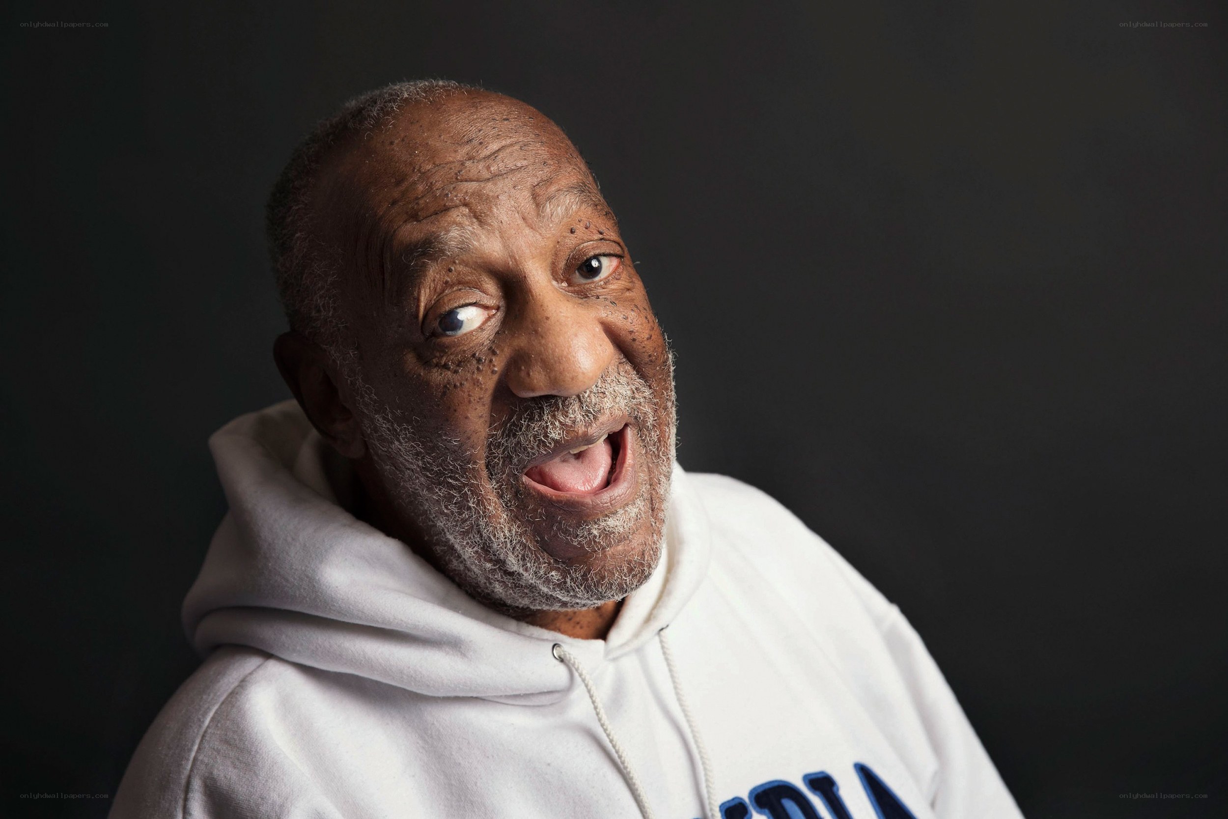man in white hoodie smiling