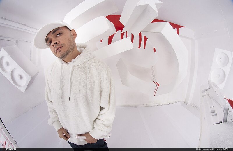 Man in white hoodie with red art