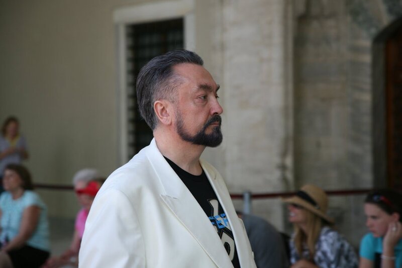 Man in white jacket at event